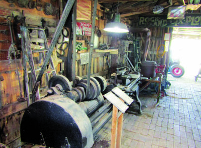 blacksmithing tools on display behind plaques.